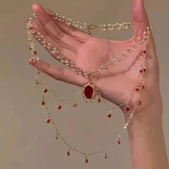 “Royal Red Gemstone Layered Necklace with Gold Chains”